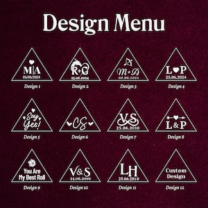 May include: A design menu with twelve triangular designs. Each design features initials, dates, and symbols like hearts and arrows. The text "Design Menu" is at the top. The background is a dark burgundy color.