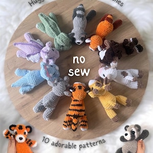 May include: A selection of colourful, handmade crochet animal toys, including a tiger, raccoon, and giraffe, displayed on a wooden surface. The image includes the text "Huggie buddies by lilbeanstitches" and "no sew". The phrase "10 adorable patterns" is also visible.