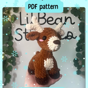 May include: A crocheted brown and white baby deer plush toy with a white background. The text "Baby deer PDF pattern" and "By lilbeanstitches" is visible in the image.