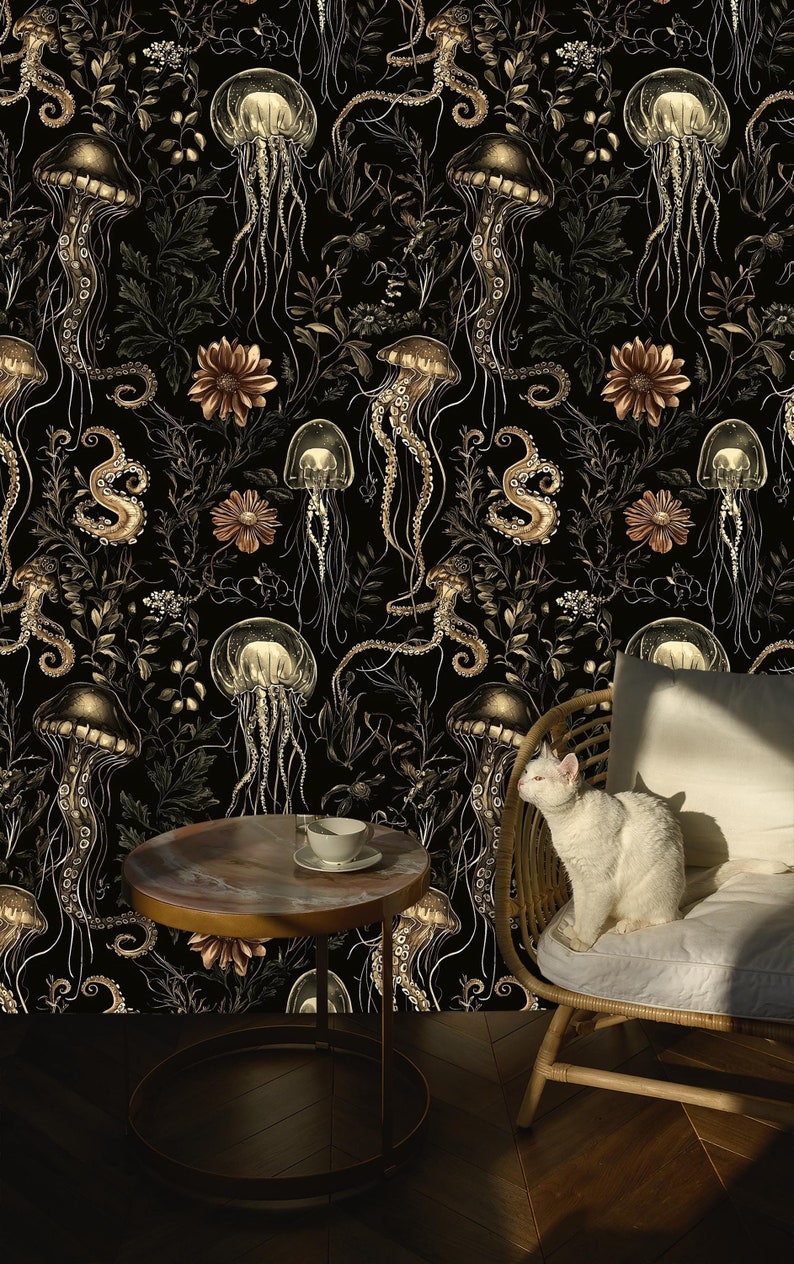 May include: Black and gold wallpaper featuring a repeating pattern of jellyfish, octopus tentacles, and flowers. The wallpaper is shown in a room with a white cat sitting on a wicker chair and a round table with a cup and saucer.