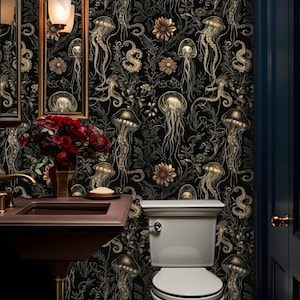 May include: A black and gold bathroom with a toilet and a sink. The walls are covered in wallpaper with a pattern of jellyfish and seahorses.