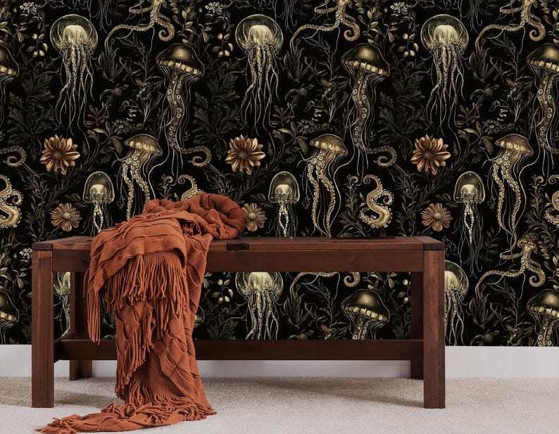 May include: A dark brown wooden bench with a brown throw blanket in front of a black and gold wallpaper featuring a repeating pattern of jellyfish and sea creatures.
