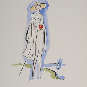 Puede incluir: Una ilustración de acuarela de una mujer con un vestido blanco y un sombrero de paja de ala ancha, sosteniendo una rosa roja. Está de pie en una playa con un velero en la distancia.