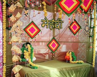 Haldi Mehndi Backdrop Decor Set – Umbrellas, Flower Strings, Potlis, Cushion Covers, Table Runner