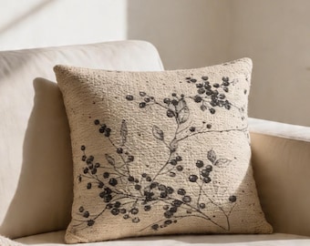 Coussin tissé floral noir - Design botanique vintage neutre
