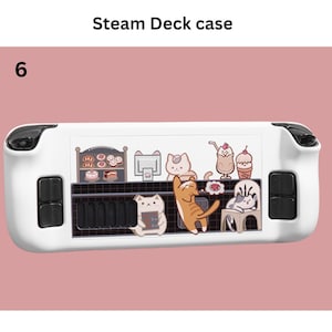 May include: White Steam Deck case with black detailing and a colourful cat-themed design. The case has a decorative panel with cartoon cats, desserts, and cafe elements. The text "Steam Deck case" is at the top.