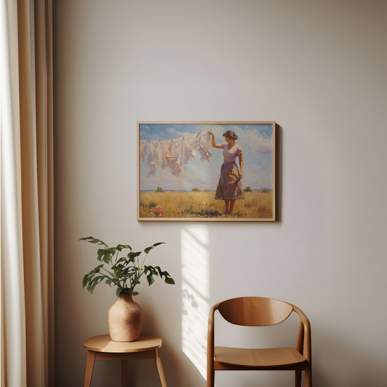 May include: A painting depicting a woman in a field, hanging laundry on a clothesline. The woman is wearing a purple dress and has her hair tied back. The sky is blue with clouds in the distance.