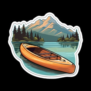May include: A brown canoe sits on a calm lake with a mountain range in the background. The lake is surrounded by green trees and the sky is a light blue.