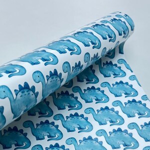 Papel de regalo de dinosaurio azul: adorable papel de regalo de dinosaurios, ideal para cumpleaños infantiles, baby shower, temática de dibujos animados, diseño jurásico en acuarela.