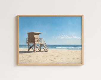 Könnte beinhalten: Ein gerahmter Druck einer Strandszene. Ein hölzerner Rettungsturm steht an einem Sandstrand, mit dem Meer und dem blauen Himmel im Hintergrund. Der Druck befindet sich in einem hellbraunen Holzrahmen.