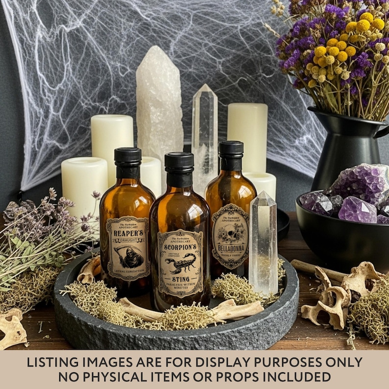 May include: Three amber glass apothecary bottles with vintage-style labels reading Reaper's Draught, Scorpion's Sting, and Belladonna. The bottles feature detailed illustrations of a grim reaper, a scorpion, and a skull, arranged on a dark stone tray.