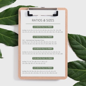 May include: A clipboard with a list of print ratios and sizes. The text includes inches and centimeters for various print sizes, such as 4x6 inches (10x15 cm) and 8x10 inches (20x25 cm). The document is on a wooden clipboard.