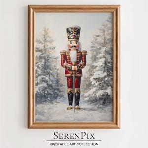 May include: A framed painting of a traditional wooden nutcracker soldier in a red and gold uniform, standing in a snowy forest setting.