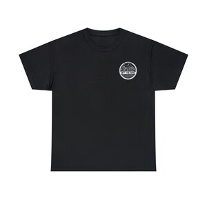 May include: Black short-sleeved t-shirt with a white graphic of a mountain range and the text "Dams of the Grid" in a circle.