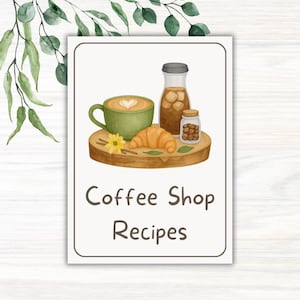 May include: A watercolor illustration of coffee shop items on a wooden tray. The tray holds a green mug of coffee with a heart design, a croissant, a yellow flower, a bottle of iced coffee, and a jar of coffee beans. The text "Coffee Shop Recipes" is below.