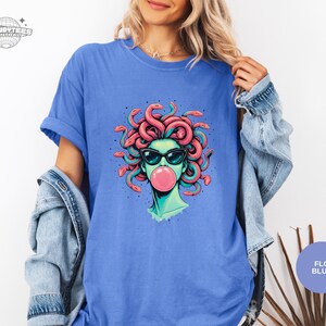 Flo Blue Comfort Colors tee with the Medusa graphic printed front and center. The washed blue tone gives the overall look a softer, vintage-worn feel. Great option for casual outfits.