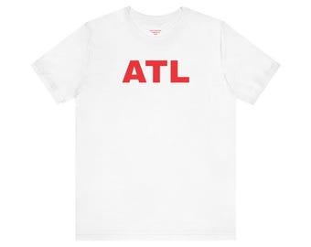May include: White t-shirt with the word "ATL" printed in red on the front.