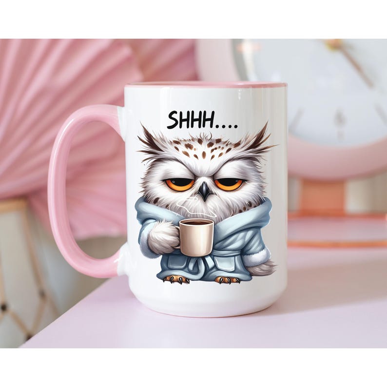 May include: White ceramic mug with a pink handle and interior. The mug features a cartoon owl wearing a robe and holding a coffee cup, with the text "SHHH...." above the owl.