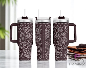 May include: A set of three brown insulated tumblers with white floral designs. Each tumbler has a handle, a white straw, and a lid. The tumblers are on a light-colored surface.