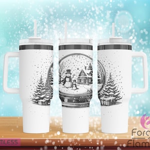 May include: Three white stainless steel tumblers with black lids and handles. Each tumbler features a black and white illustration of a snow globe with a snowman, a house, and a pine tree inside. The tumblers are perfect for winter holidays.