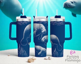May include: Navy blue insulated tumbler featuring a white illustration of manatees swimming underwater. The tumbler has a handle, a silver lid, and a white straw. The background shows a blue ocean scene with sun rays and other manatees.