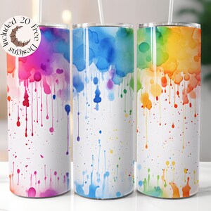 May include: Three stainless steel tumblers with colorful watercolor designs. The tumblers feature a white background with dripping paint in shades of pink, blue, and yellow.