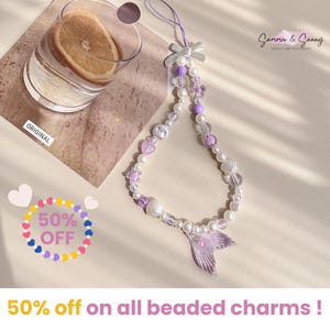 Lindo dije morado.Dije para teléfono con perlas y cuentas de sirena.Regalo para todos.Llavero para teléfono con forma de corazón.Correa para cámara.Dije de océano.Muñequera para teléfono.Dije Y2K.