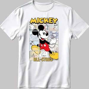 May include: White t-shirt with a cartoon image of Mickey Mouse in a red and yellow outfit. The image is surrounded by smaller images of Mickey Mouse in different poses. The text "MICKEY ALL-STARS" is printed below the image.