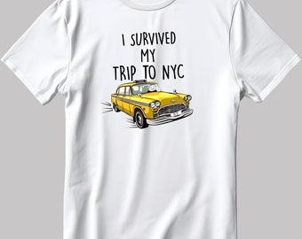 May include: White t-shirt with a yellow taxi cab graphic and the text "I survived my trip to NYC".