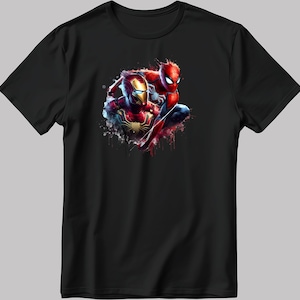 May include: Black t-shirt featuring a graphic of Iron Man and Spider-Man in a dynamic pose with red and blue paint splatters.