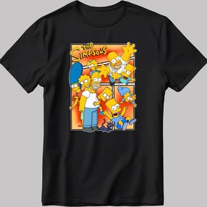May include: A black t-shirt featuring a graphic of the Simpsons family. The graphic depicts the Simpsons family in a comic book style with the text "The Simpsons" above them.