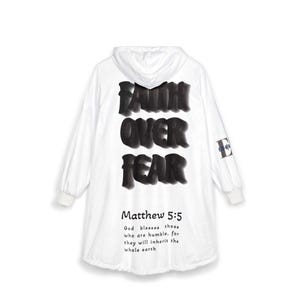 May include: White hooded sweatshirt featuring the text "FAITH OVER FEAR" in large, black, textured letters on the back. The text "Matthew 5:5" and a Bible verse are below. A small "E" logo is on the sleeve.
