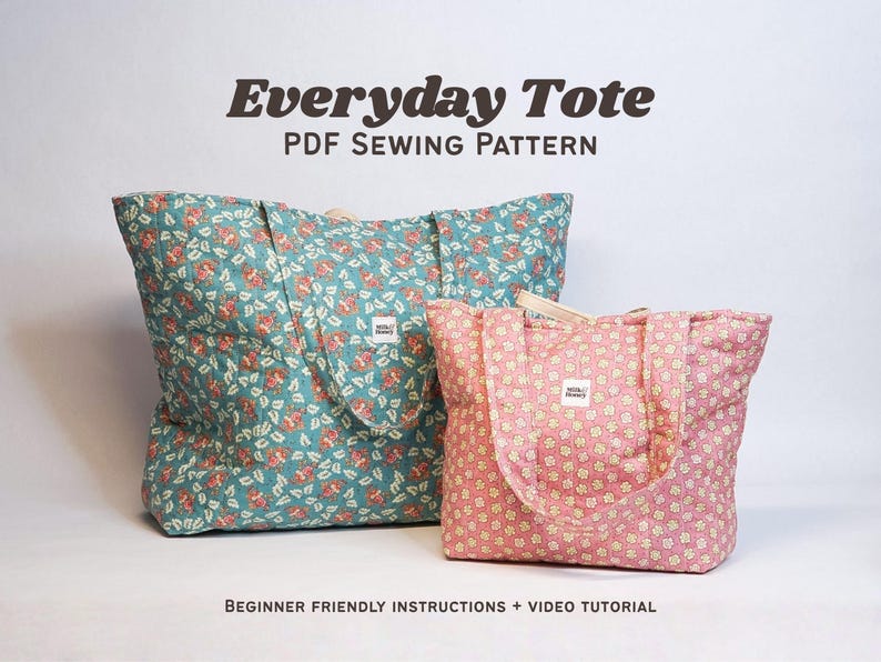 two quilted tote bags sitting on a white background. The larger tote is teal with pink flowers, and the smaller tote is pink with cream flowers. The text reads "Everyday Tote PDF Sewing Pattern"