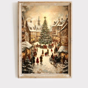 May include: Framed vintage painting of a snowy Christmas village scene. The artwork depicts a large decorated Christmas tree in the town square, surrounded by people and buildings with lit windows. A horse-drawn carriage is in the foreground.