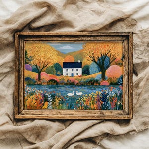 May include: A rectangular landscape painting in a dark wood frame depicting a white house with a blue roof situated by a river. Two white swans swim in the water, surrounded by vibrant autumn trees, colorful bushes, and a foreground of wildflowers.