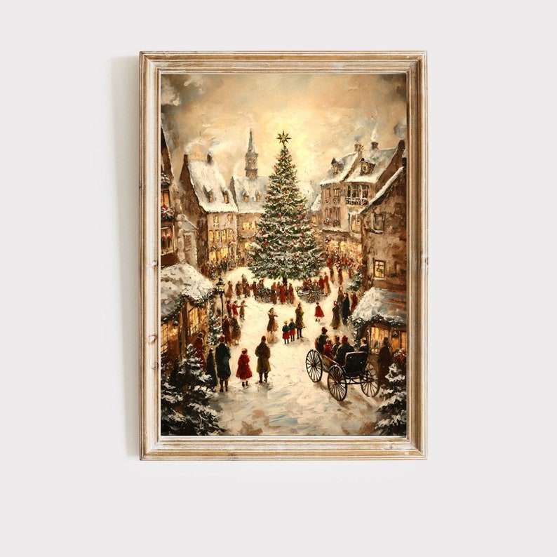 May include: Framed vintage painting of a snowy Christmas village scene. The artwork depicts a large decorated Christmas tree in the town square, surrounded by people and buildings with lit windows. A horse-drawn carriage is in the foreground.
