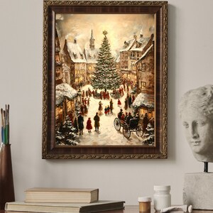 May include: A framed painting depicts a snowy Christmas scene in a European village. The artwork features a large Christmas tree, horse-drawn carriage, and figures in winter attire. The frame is a dark brown with ornate detailing.