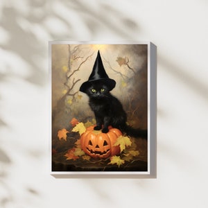 May include: A black cat wearing a witch's hat sits on top of a carved orange pumpkin. The cat has green eyes and is looking directly at the viewer. The pumpkin is surrounded by fallen autumn leaves.
