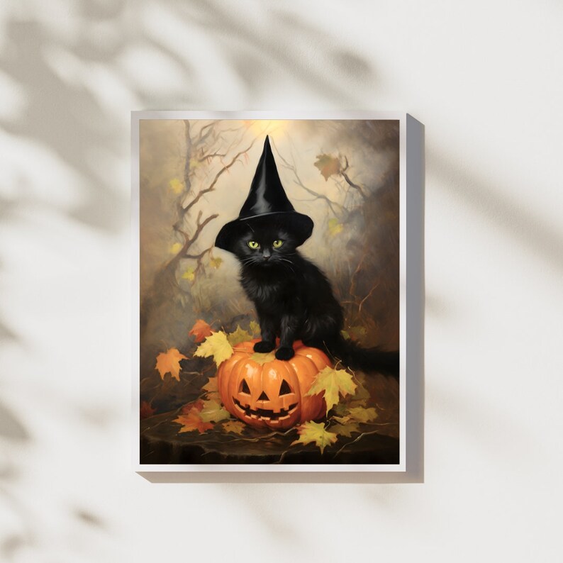 May include: A black cat wearing a witch's hat sits on top of a carved orange pumpkin. The cat has green eyes and is looking directly at the viewer. The pumpkin is surrounded by fallen autumn leaves.
