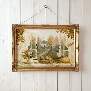 May include: A framed landscape painting depicting an open window view of a cottage, a stone path, and autumn trees. The windowsill features a vase of flowers, a basket of apples, a stack of books with a teacup, and a pumpkin on a lace cloth.