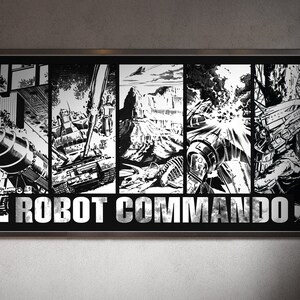 Può includere: Opera d'arte incorniciata in bianco e nero con un'illustrazione in stile fumetto. L'opera è divisa in pannelli che raffigurano scene di costruzione e azione, con il testo "ROBOT COMMANDO" in lettere argentate in grassetto.