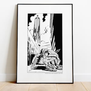 May include: Black and white framed print featuring a detailed illustration of a futuristic robot in a city setting. The artwork includes a tall skyscraper and the text "Fighting Fantasy Robot Commando: Cargo Crab."