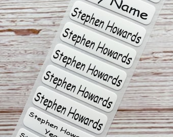 May include: A sheet of white rectangular labels with black text. The labels read "Any Name", "Stephen Howards", and "Stephen Howards Year 5".