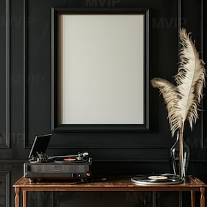 May include: A black framed poster hangs above a vintage record player and a record on a wooden table. A vase with dried feathers sits on the table. The background is a dark, wood-paneled wall.