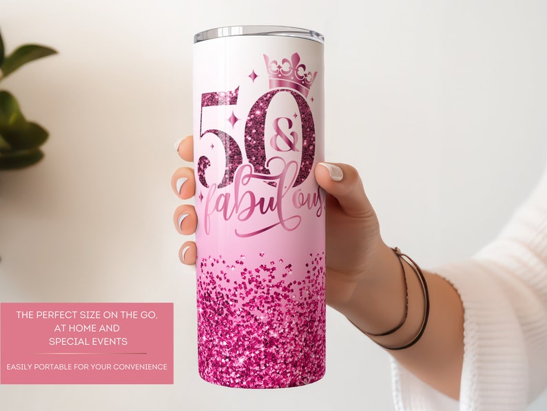 May include: Pink and white stainless steel tumbler with a glitter design and the text "50 & Fabulous" with a crown above the 50.