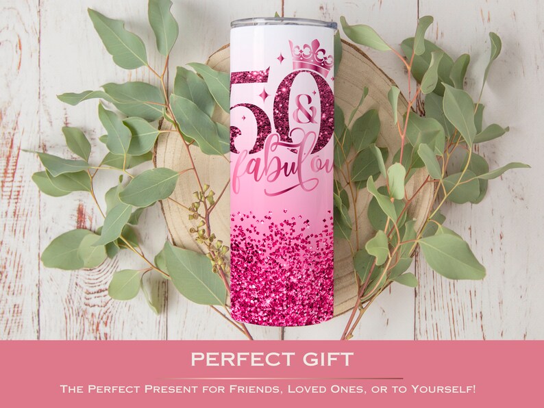 May include: Pink and white tumbler with a glitter design and the text "50 & fabulous" with a crown on top.