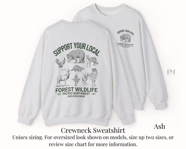 May include: A gray crewneck sweatshirt with the text "Support Your Local Forest Wildlife" and a graphic of various animals, including a bear, a wolf, and a deer. The text "Pacific Northwest and Worldwide" is also included.