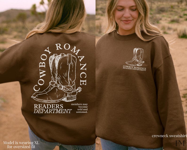 May include: Brown crewneck sweatshirt with a white graphic of cowboy boots and the text "Cowboy Romance Readers Department". The text "members may become wild and untamed" is also included on the sweatshirt.