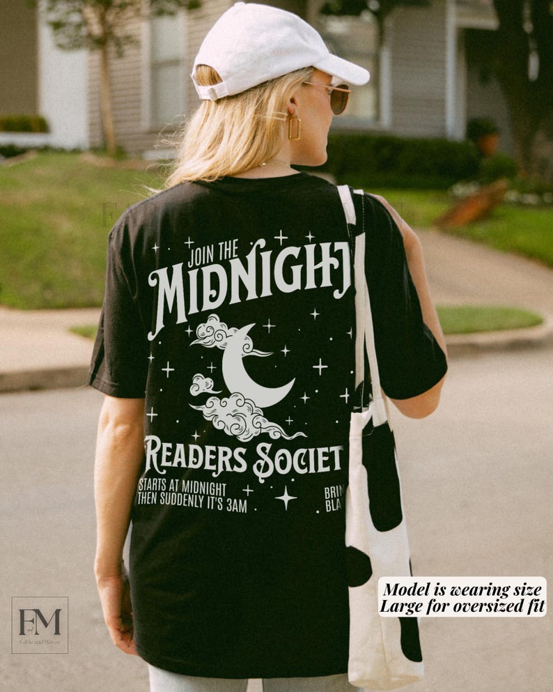 May include: Black t-shirt with white text that reads "Join the Midnight Readers Society Starts at Midnight then suddenly it's 3am". The shirt also features a white crescent moon and clouds graphic.