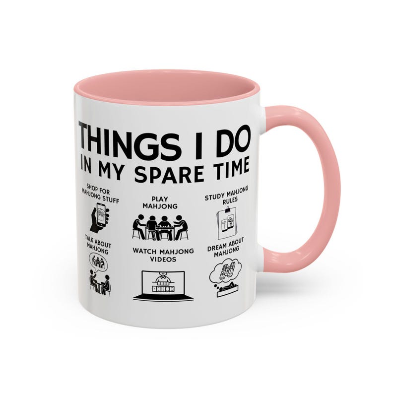 White ceramic mug with pink handle featuring funny mahjong lover design “Things I Do In My Spare Time,” perfect for players and mahjong fans.